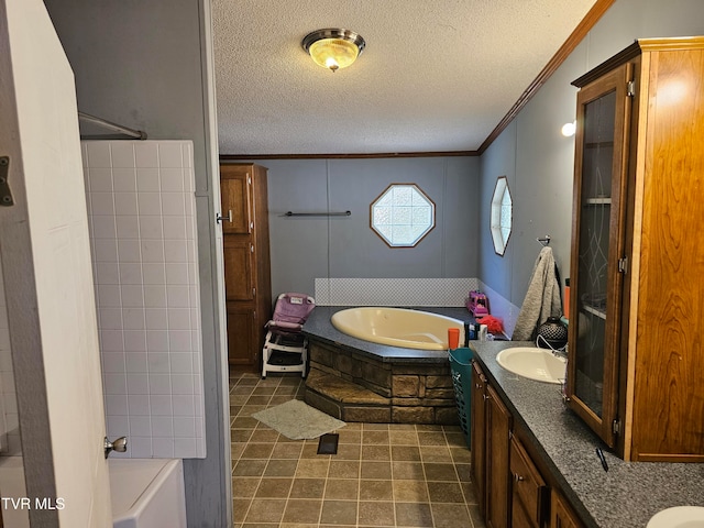 bathroom featuring crown molding, tile patterned flooring, vanity, and a textured ceiling