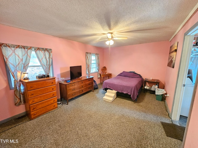 bedroom featuring ceiling fan, a textured ceiling, and carpet floors