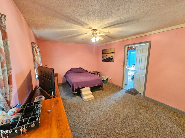 bedroom with a textured ceiling, carpet, and ceiling fan