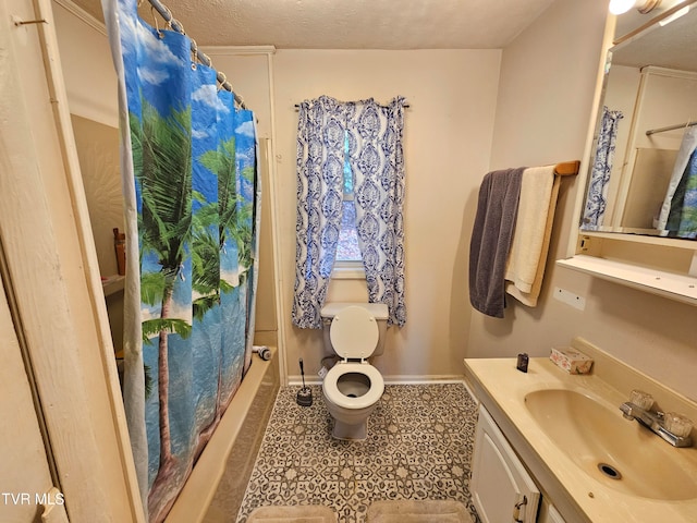 bathroom featuring toilet, a shower with curtain, vanity, and a textured ceiling