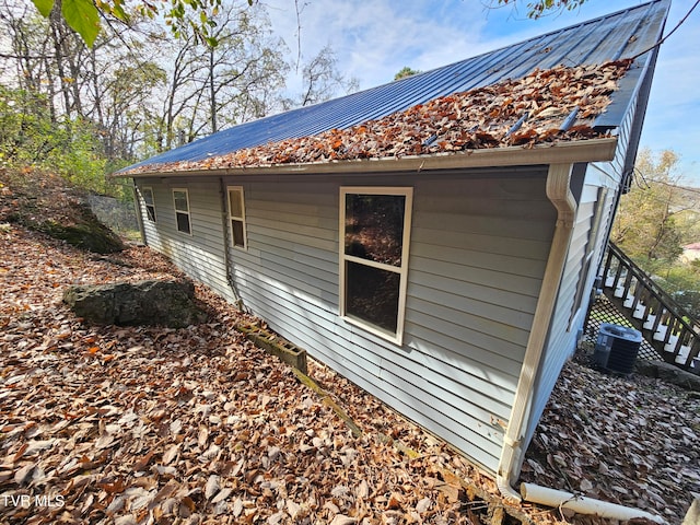 view of side of property with cooling unit