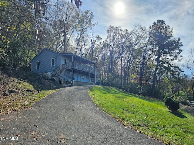 view of property featuring a garage and a front yard