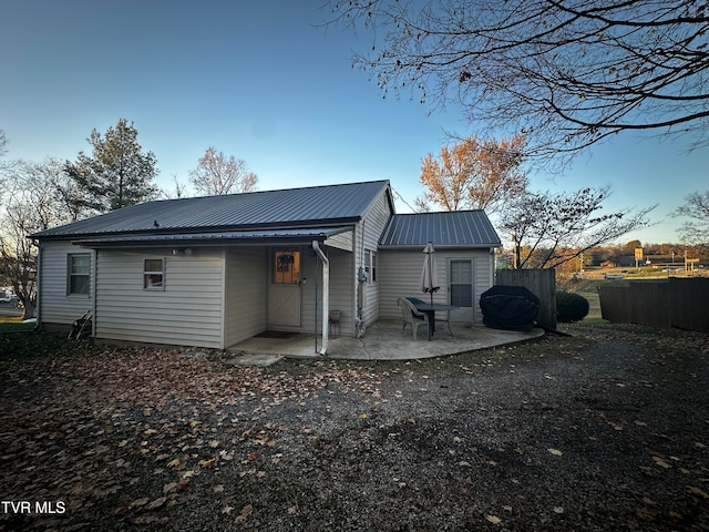 rear view of house featuring a patio