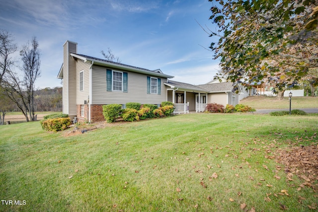 split level home featuring a front lawn