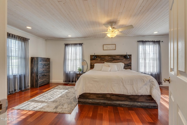 bedroom featuring wood-type flooring, wooden ceiling, ceiling fan, and multiple windows