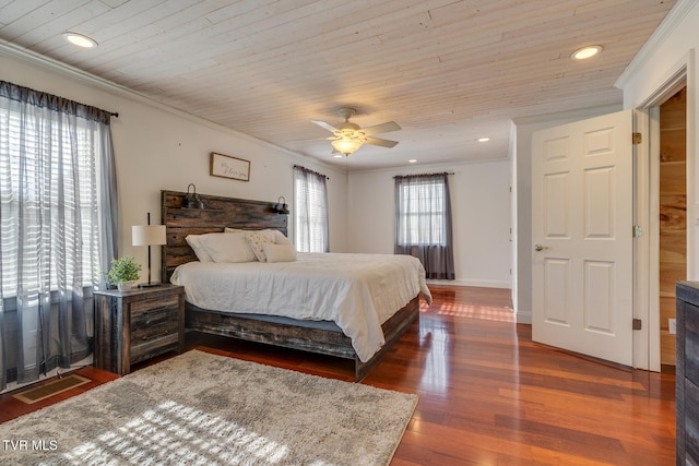 bedroom featuring wooden ceiling, dark hardwood / wood-style floors, ceiling fan, and ornamental molding