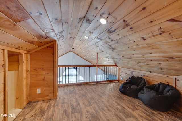 bonus room with hardwood / wood-style flooring, wood ceiling, lofted ceiling, and wood walls