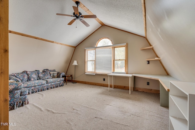 interior space featuring carpet flooring, a textured ceiling, ceiling fan, and lofted ceiling