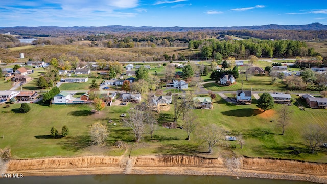 birds eye view of property featuring a water and mountain view