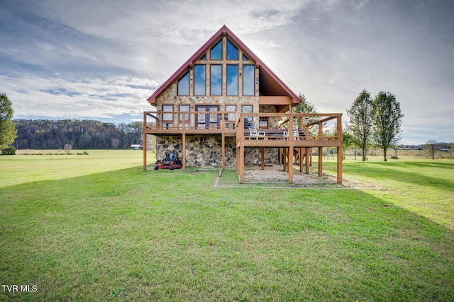 rear view of property featuring a yard and a deck