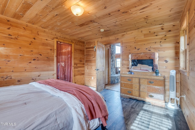 bedroom with wooden walls, hardwood / wood-style floors, and wood ceiling