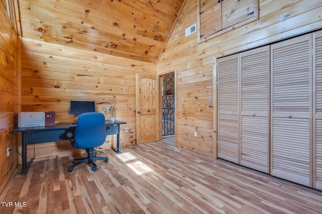 home office with wood walls, wood ceiling, and light wood-type flooring