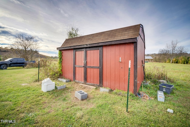 view of outdoor structure with a yard