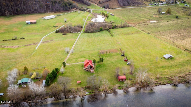 birds eye view of property featuring a rural view and a water view