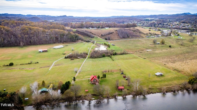 aerial view featuring a rural view and a water and mountain view