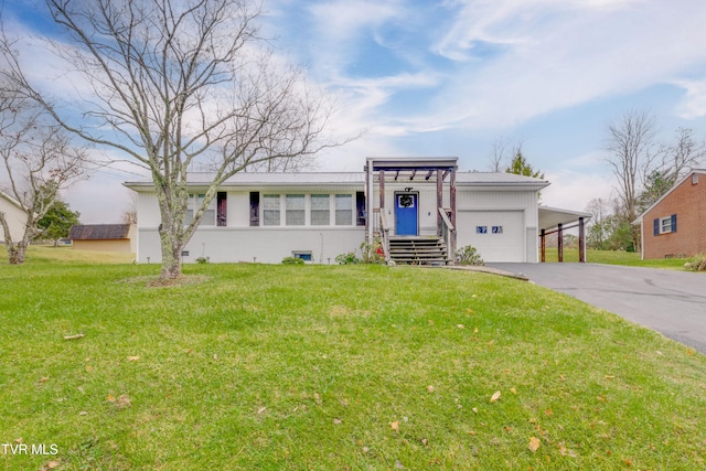 ranch-style house featuring a front yard and a carport