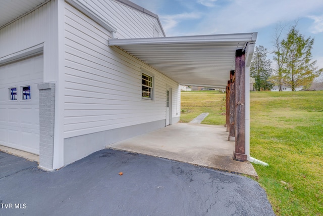 exterior space featuring a garage and a carport