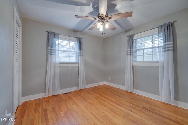 unfurnished room featuring light hardwood / wood-style floors and ceiling fan