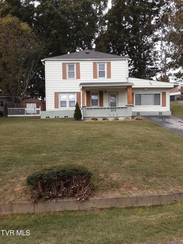 front of property featuring a porch and a front yard