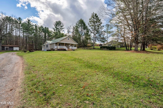 view of yard featuring covered porch