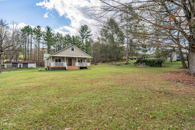 view of yard featuring covered porch