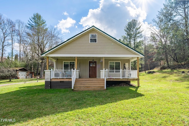 bungalow with a front lawn and covered porch