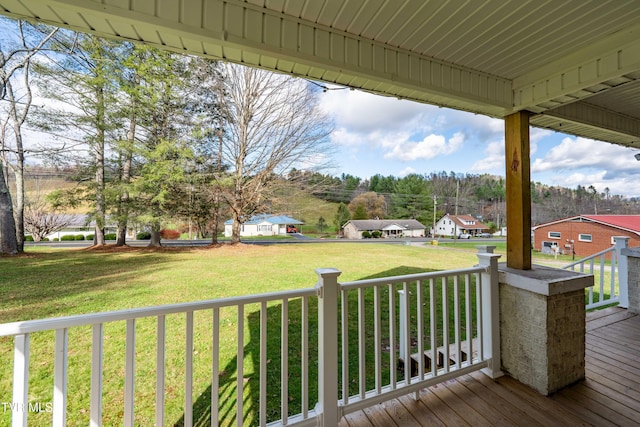 deck featuring a lawn