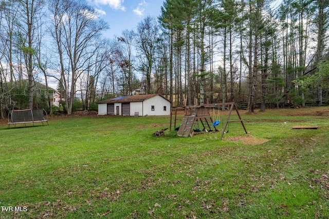 view of yard featuring a playground, an outbuilding, and a trampoline