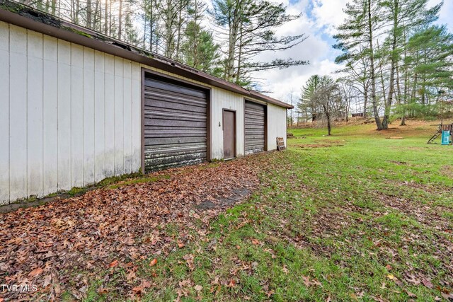 garage with a yard