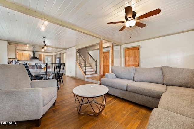 living room with ceiling fan, wood-type flooring, and wooden ceiling