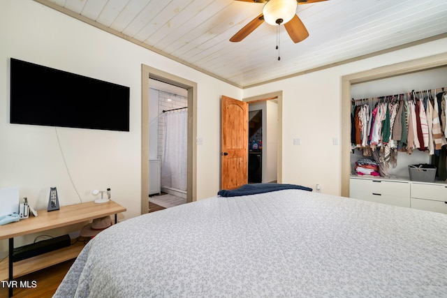 bedroom featuring ceiling fan, wooden ceiling, dark hardwood / wood-style flooring, a closet, and ornamental molding