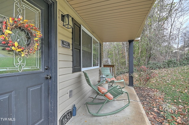 doorway to property featuring covered porch