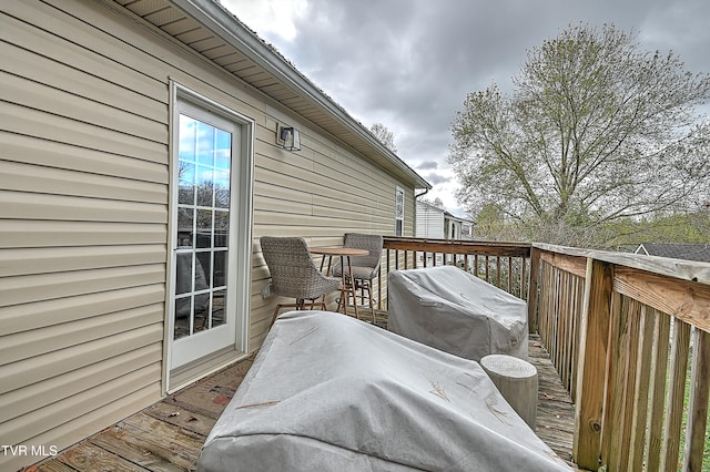 wooden terrace featuring area for grilling