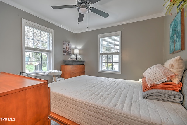 bedroom featuring ceiling fan and crown molding