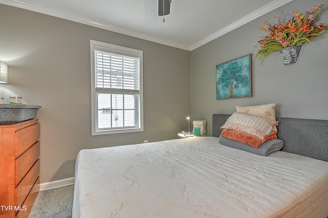 bedroom featuring ceiling fan and crown molding