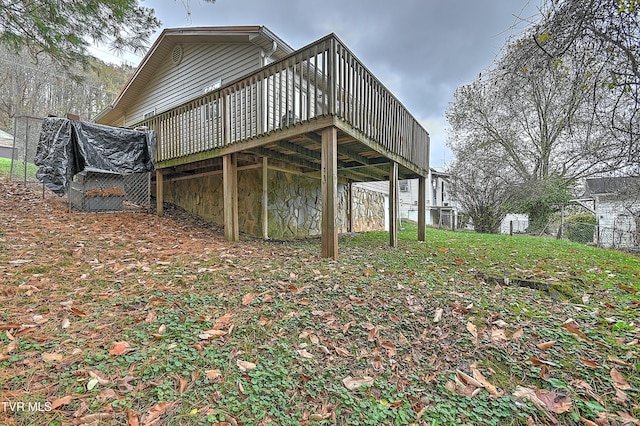 view of property exterior with a wooden deck