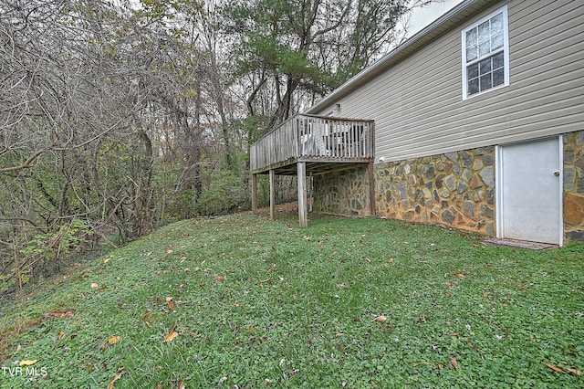 view of yard featuring a wooden deck