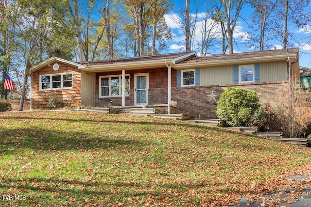 ranch-style house featuring a front yard