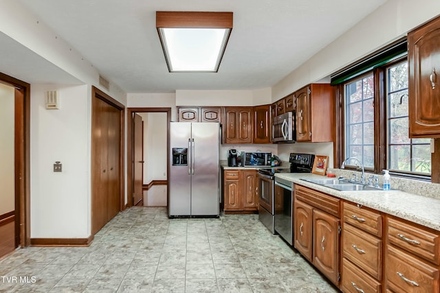 kitchen featuring appliances with stainless steel finishes and sink