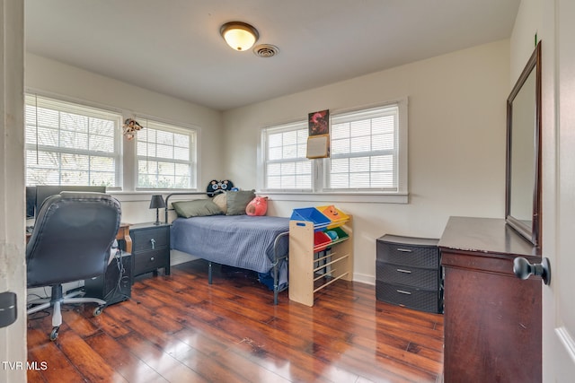 bedroom featuring dark hardwood / wood-style floors