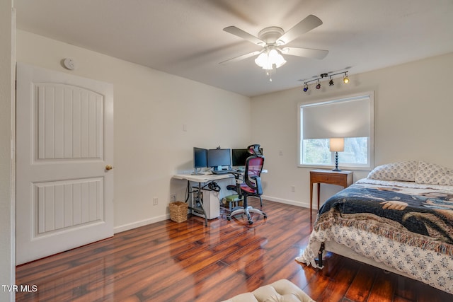 bedroom with ceiling fan and dark hardwood / wood-style flooring