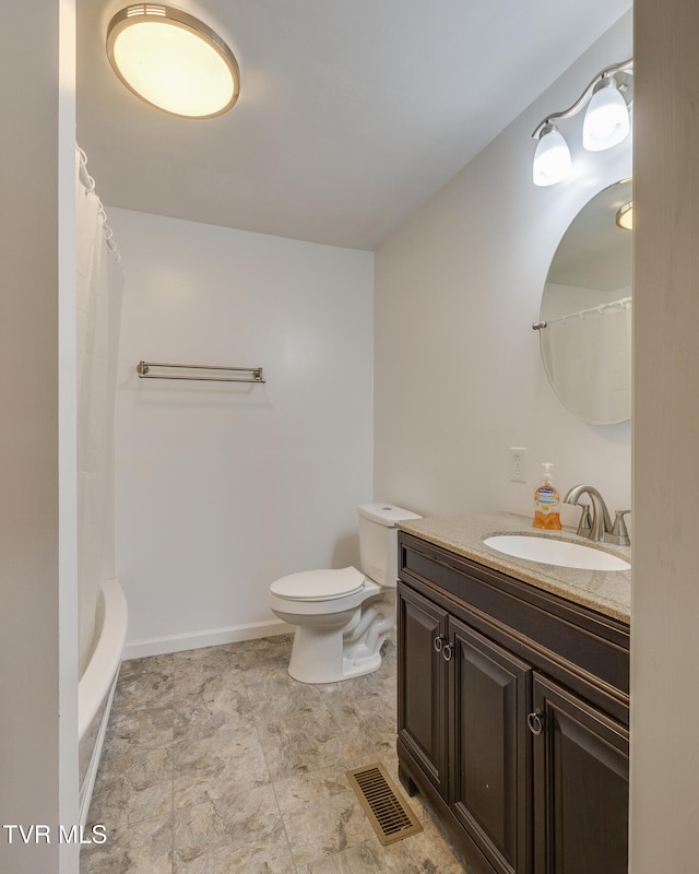 bathroom featuring vanity, a shower with shower curtain, and toilet