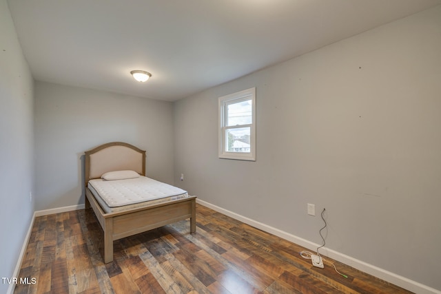 bedroom featuring dark wood-type flooring