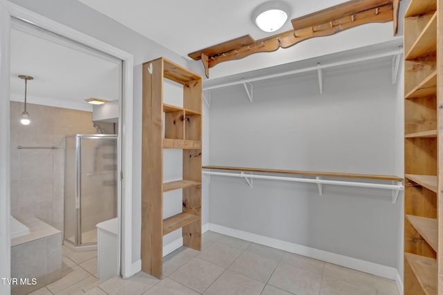 walk in closet featuring light tile patterned floors