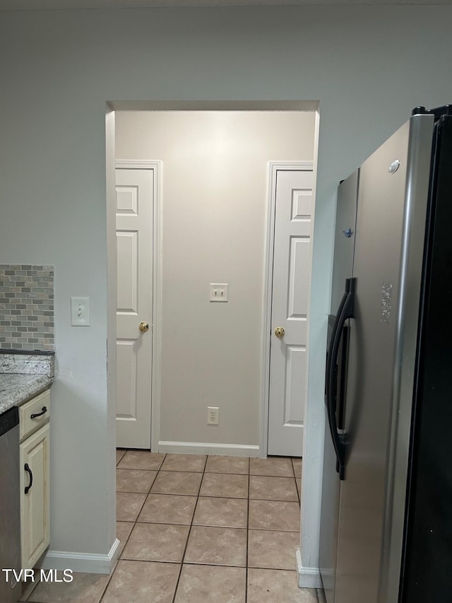 152 Gray Station Rd Unit 18, Gray, TN 37615 - kitchen featuring refrigerator with ice dispenser, light tile patterned floors, dishwasher, decorative backsplash, and light stone counters