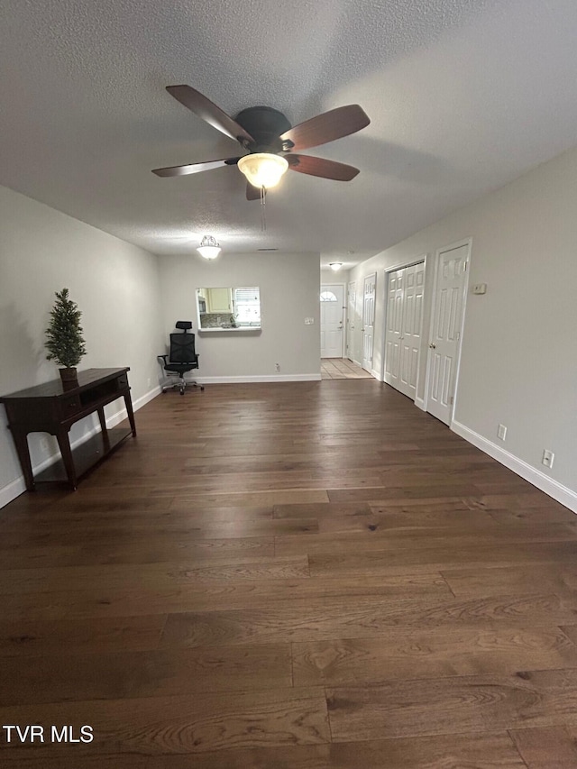 152 Gray Station Rd Unit 18, Gray, TN 37615 - unfurnished living room with a ceiling fan, wood finished floors, and a textured ceiling