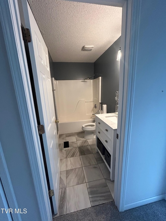 full bathroom featuring tile patterned floors, tub / shower combination, a textured ceiling, vanity, and toilet