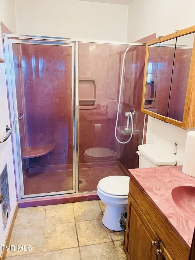 128 Graybeal Dr, Castlewood, VA 24224 - bathroom featuring toilet, vanity, a shower stall, and heating unit