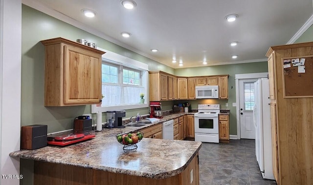 kitchen featuring kitchen peninsula, light brown cabinetry, white appliances, crown molding, and sink