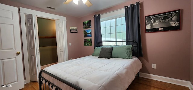 bedroom with hardwood / wood-style floors and ceiling fan